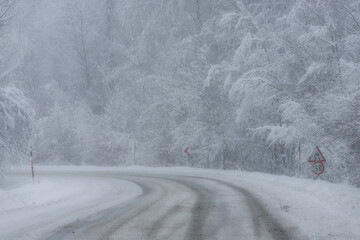 Snowy and frozen mountain road in winter landscape. Uludag National Park. Bursa, Turkey. 