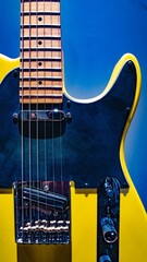 Yellow black electric guitar on colored background - obrazy, fototapety, plakaty