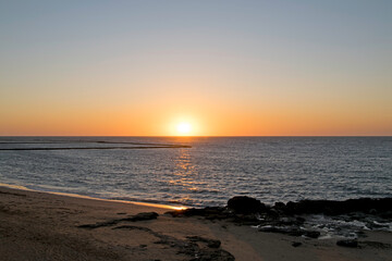 Fototapeta na wymiar Sunset on a beach in Chipiona, Cadiz, Andalusia, Spain