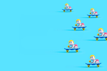 Baby dolls riding skateboard on pastel blue background