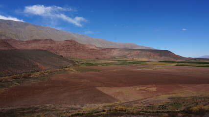 Fototapeta na wymiar gravel road through a mountain valley in argentina