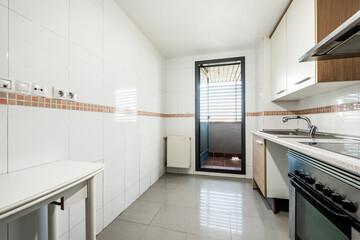 Kitchen with access to a drying terrace in a vacation rental apartment