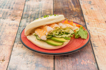 bao is a type of lotus leaf bun that originates from Fujian cuisine. It is also a popular street food in Singapore, Malaysia, Taiwan, and Nagasaki Chinatown in Japan.