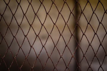 The background of the old mesh netting covered with rust.