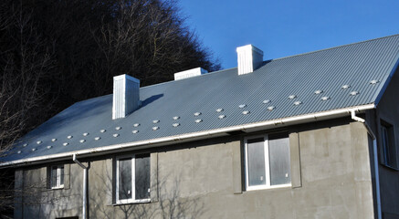 The building is covered with profiled metal sheet