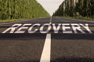 Start to live without alcohol addiction. Word RECOVERY on asphalt highway
