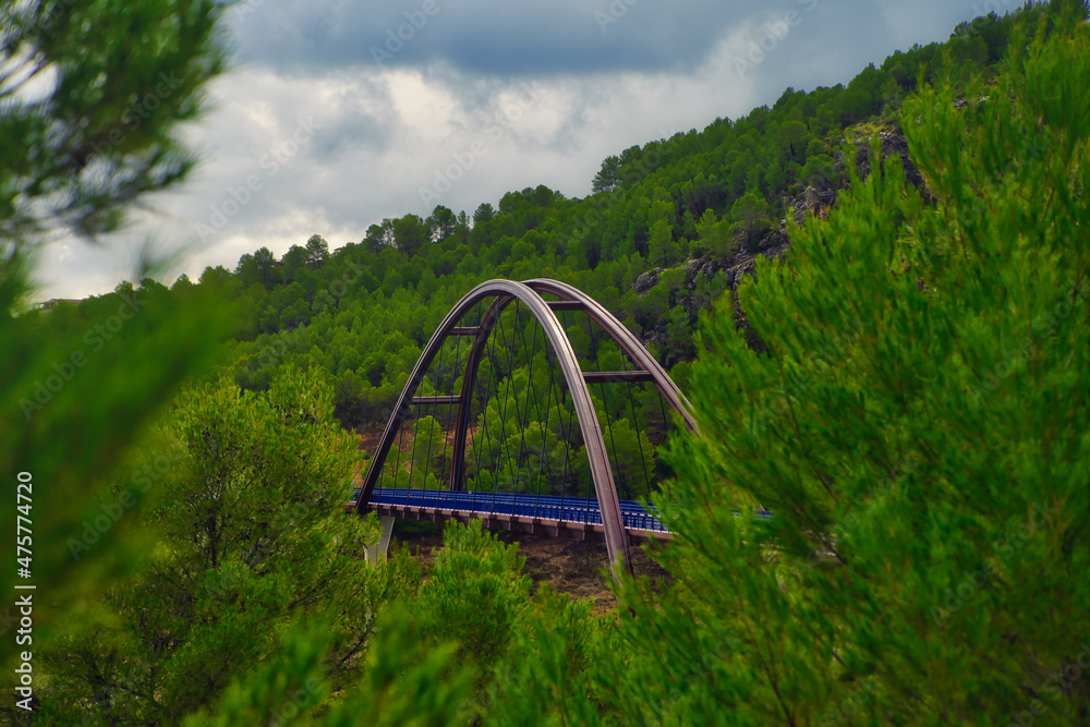 Poster beautiful autumn view with the vicaria bridge in yeste, spain