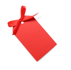 Blank red gift tag with satin ribbon on white background, top view