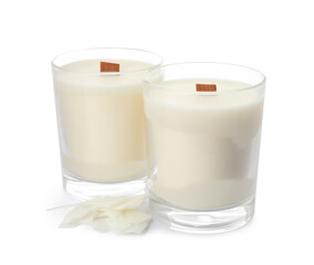Aromatic soy candles with wooden wicks on white background