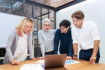 Team of Asian people with different age group brainstorming on data and information analysis for strategy management with senior woman leader for education and business concept