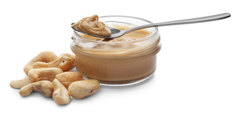 Jar and spoon with delicious cashew butter on white background