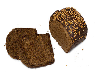Sliced black bread sprinkled with coriander. Borodino bread. Flour product. Healthy food.   Bread with spices on white background