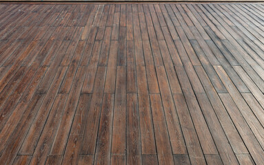   A floor made of yellowish brown wood strips