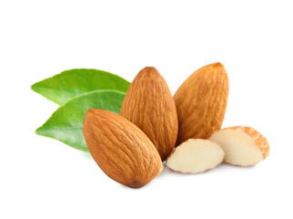 Organic almond nuts and green leaves on white background. Healthy snack