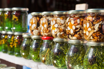 Jars of jam from fir cones and almonds.