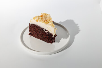 Sliced piece of cake on white background