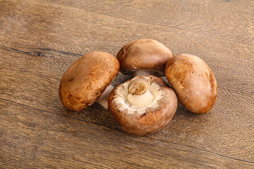 Raw brown champignons mushroom heap