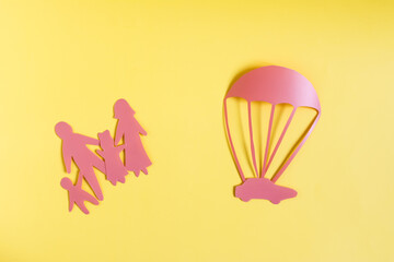 The concept of buying a car. Minimalistic painting depicting a family, a rescue parachute and a car