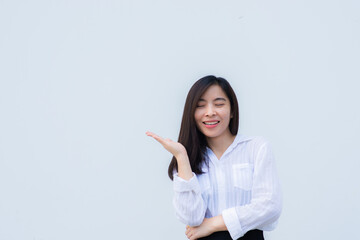 close up attractive adult business woman asian girl with happy and smile against white concrete wall office.