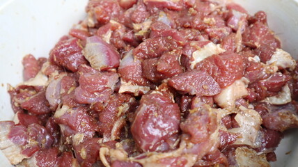 Obraz premium Preparation of cut meat for satay