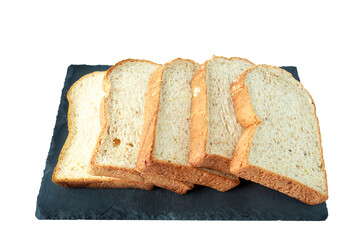 selective focus of pile of toasted bread slices on a single black plate. On pure white background.