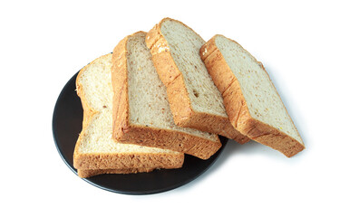 selective focus of pile of toasted bread slices on a single black plate. On pure white background.