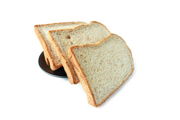 selective focus of pile of toasted bread slices on a single black plate. On pure white background.