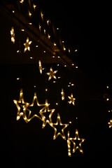 Fototapeta na wymiar Hanging star shaped string lights