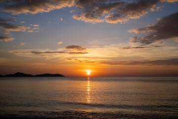  Beautiful scene of seascape during the sunset time. Very nice clouds and sun light at the beautiful beach of Thailand.