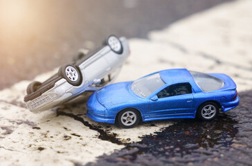 Collision of two cars on a solid road marking line.