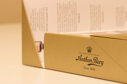 Portland, OR, USA - Nov 1, 2021: Closeup of the Anthon Berg logo seen on an Anthon Berg Dark Chocolate Liqueurs gift box. Anthon Berg is a Danish chocolatier and a brand owned by Toms International.