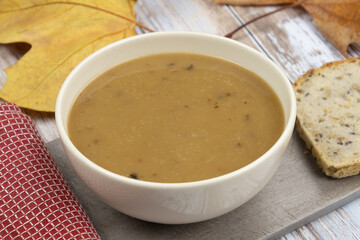 homemade cream soup with bread slices on table