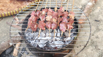 The satay is being grilled
