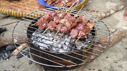 The satay is being grilled