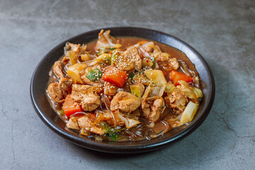 Andongjjimdak, Andong-style spicy stewed chicken : Originally from the Andong region, this dish consists of chicken, chili peppers, potatoes, clear noodles, leeks and carrots braised in a spicy sauce 