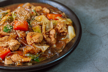 Andongjjimdak, Andong-style spicy stewed chicken : Originally from the Andong region, this dish consists of chicken, chili peppers, potatoes, clear noodles, leeks and carrots braised in a spicy sauce 