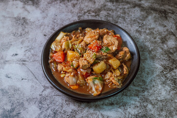 Andongjjimdak, Andong-style spicy stewed chicken : Originally from the Andong region, this dish consists of chicken, chili peppers, potatoes, clear noodles, leeks and carrots braised in a spicy sauce 