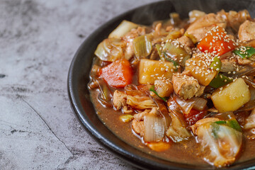 Andongjjimdak, Andong-style spicy stewed chicken : Originally from the Andong region, this dish consists of chicken, chili peppers, potatoes, clear noodles, leeks and carrots braised in a spicy sauce 