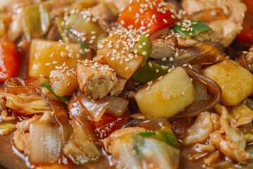 Andongjjimdak, Andong-style spicy stewed chicken : Originally from the Andong region, this dish consists of chicken, chili peppers, potatoes, clear noodles, leeks and carrots braised in a spicy sauce 
