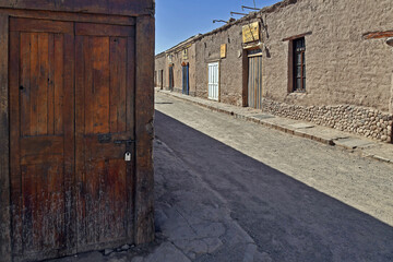 View of a street with old houses in northern Chile
