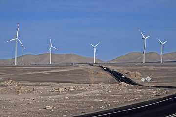 Smooth road passing through a farm of wind turbines, Northern Chile