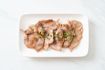 grilled pork neck sliced on plate