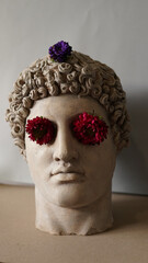 Statue of Alexander the great ornamented with colorful flowers