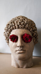 Statue of Alexander the great ornamented with colorful flowers