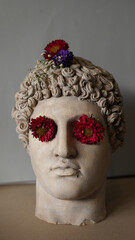 Statue of Alexander the great ornamented with colorful flowers