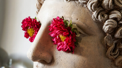 Statue of Alexander the great ornamented with colorful flowers
