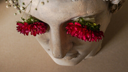 Statue of Alexander the great ornamented with colorful flowers