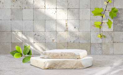 Original template for spa product presentation. Pedestal of marble slabs and branches with green...