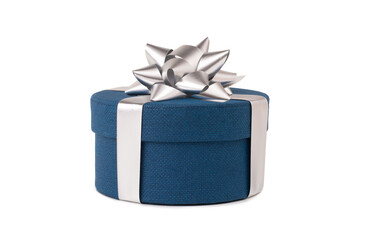 Blue round gift box covered with a silver bow isolated on a white background