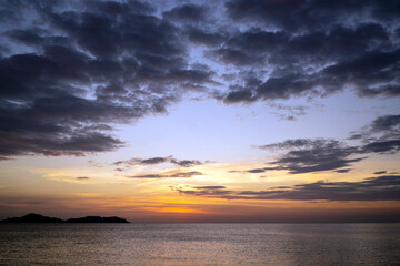Beautiful scene of seascape during the sunset time. Very nice clouds and sun light at the beautiful beach of Thailand.